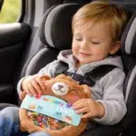 Travel Toys Toddler playing with sensory bear toy