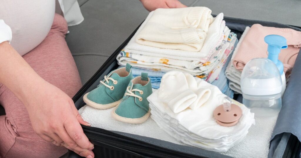 A collection of essential baby travel feeding items neatly arranged for a trip.