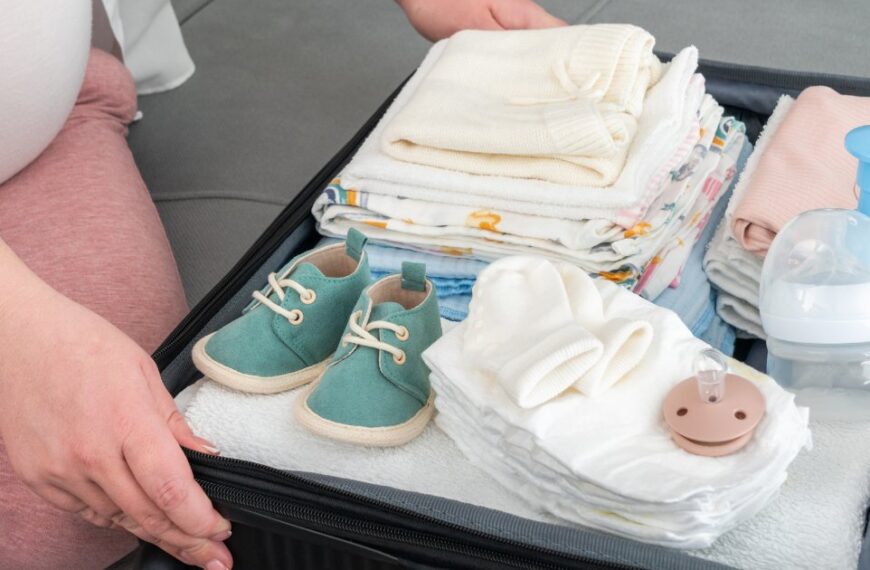 A collection of essential baby travel feeding items neatly arranged for a trip.