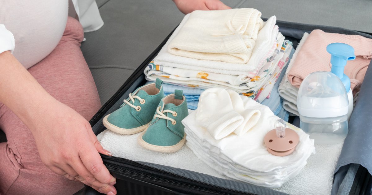 A collection of essential baby travel feeding items neatly arranged for a trip.