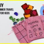 Handmade toddler travel games arranged neatly for a peaceful flight in an airplane cabin.