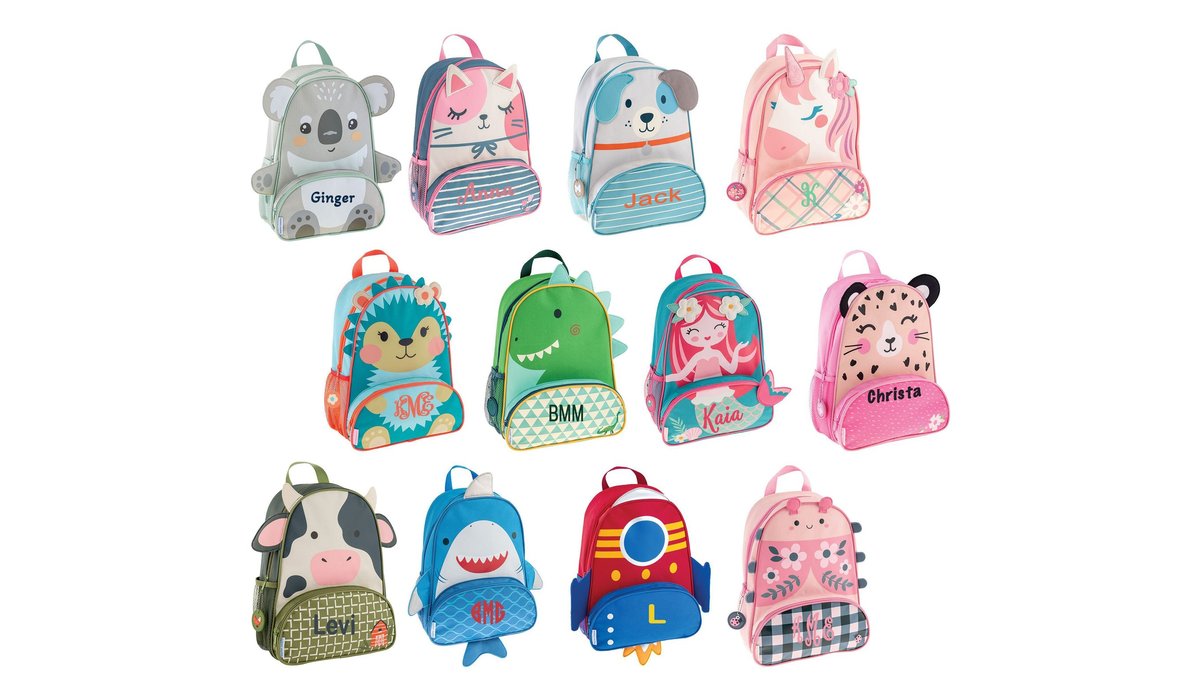 A variety of cute animal-themed toddler backpacks displayed in a bright, modern nursery.