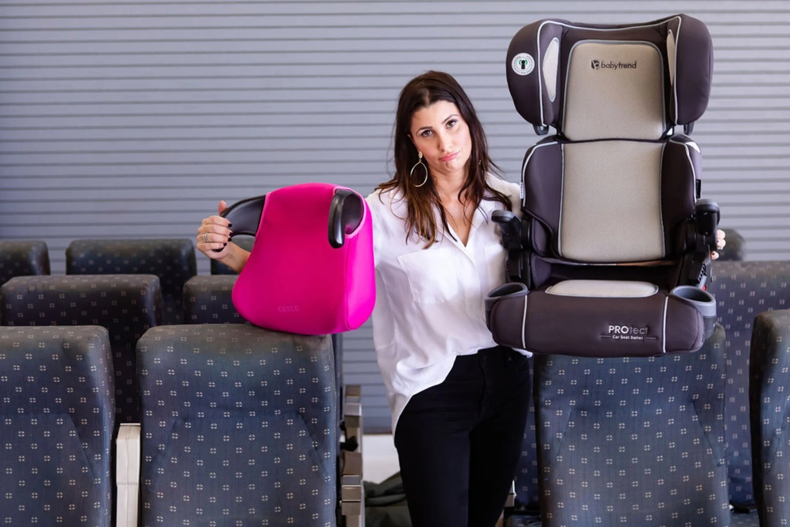 Car seat beside padded travel bag ready for flight protection