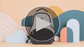 Compact sage green mini backpack on a wooden table in a bright living room