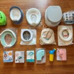 Compact travel potty for toddlers on a bathroom counter.