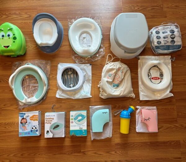 Compact travel potty for toddlers on a bathroom counter.