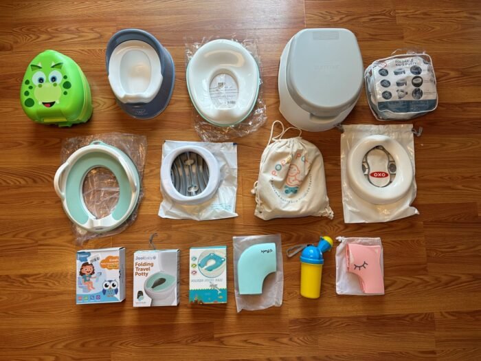 Compact travel potty for toddlers on a bathroom counter.