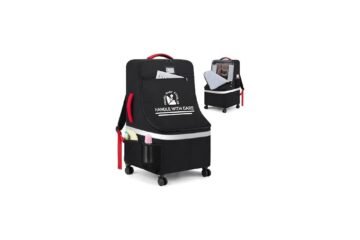 Padded car seat travel bag with wheels standing in a bright airport terminal